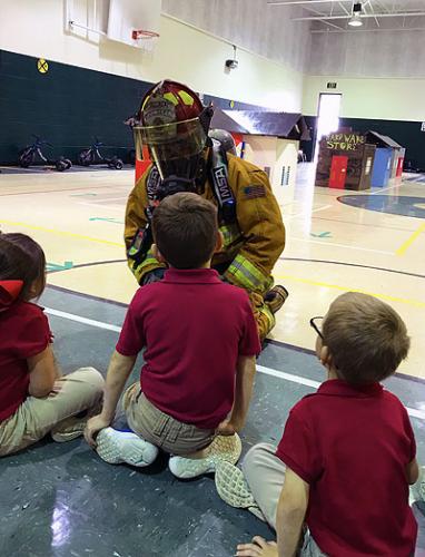kids with fire fighter